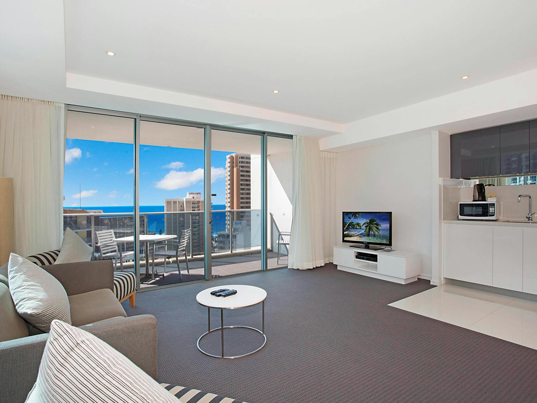 Lounge room with TV and ocean views Hilton Residences Surfers Paradise Gold Coast Holidays Lounge room with TV and ocean views Hilton Residences Surfers Paradise Gold Coast Holidays