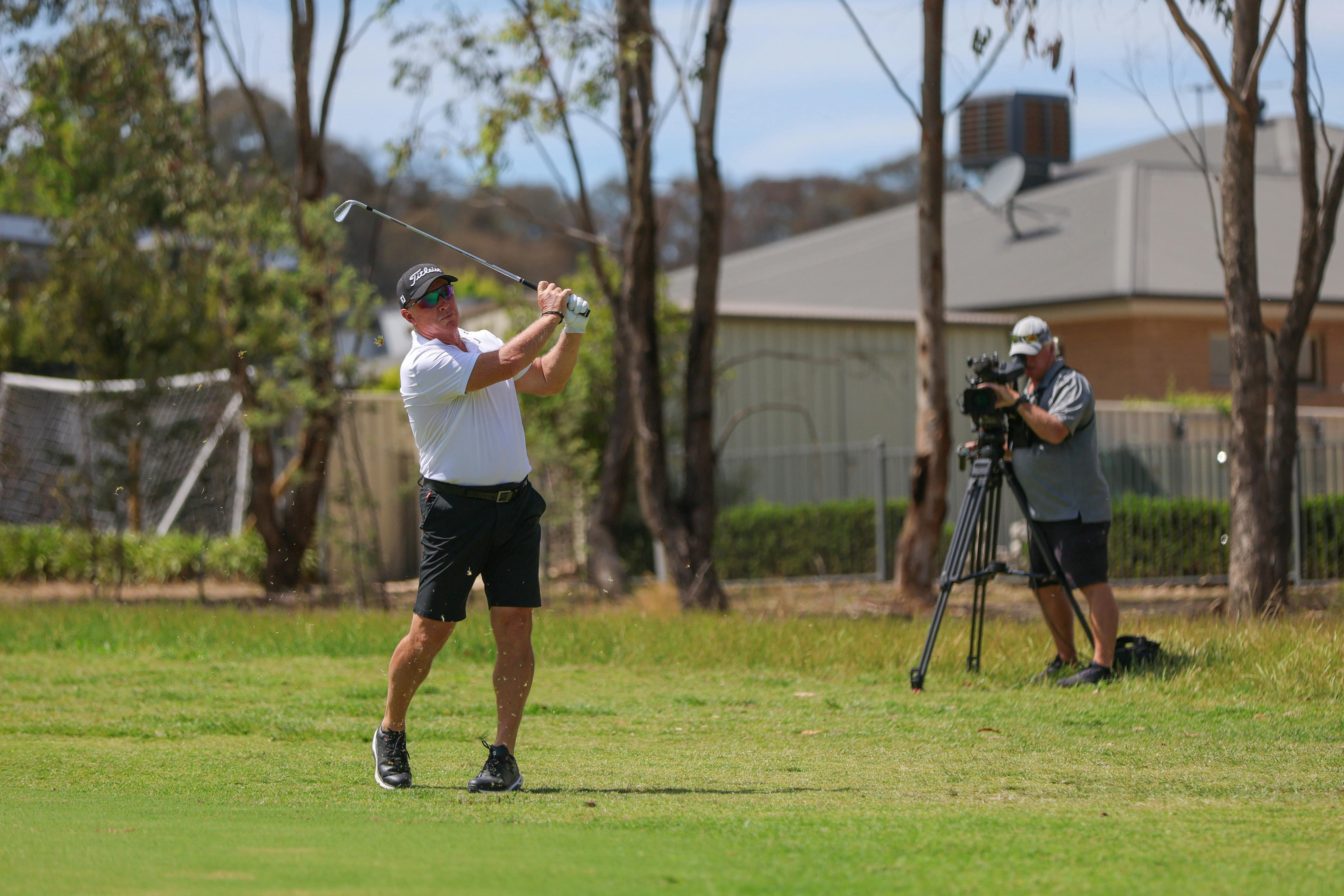 Peter Lonard hitting a golf shot on the fairway
