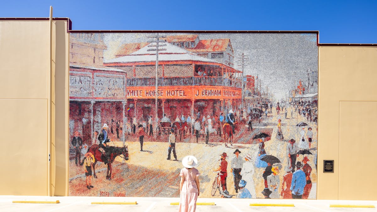 Lady looks up at Saturday Morning Gill Street 1900 -Peter Lawson