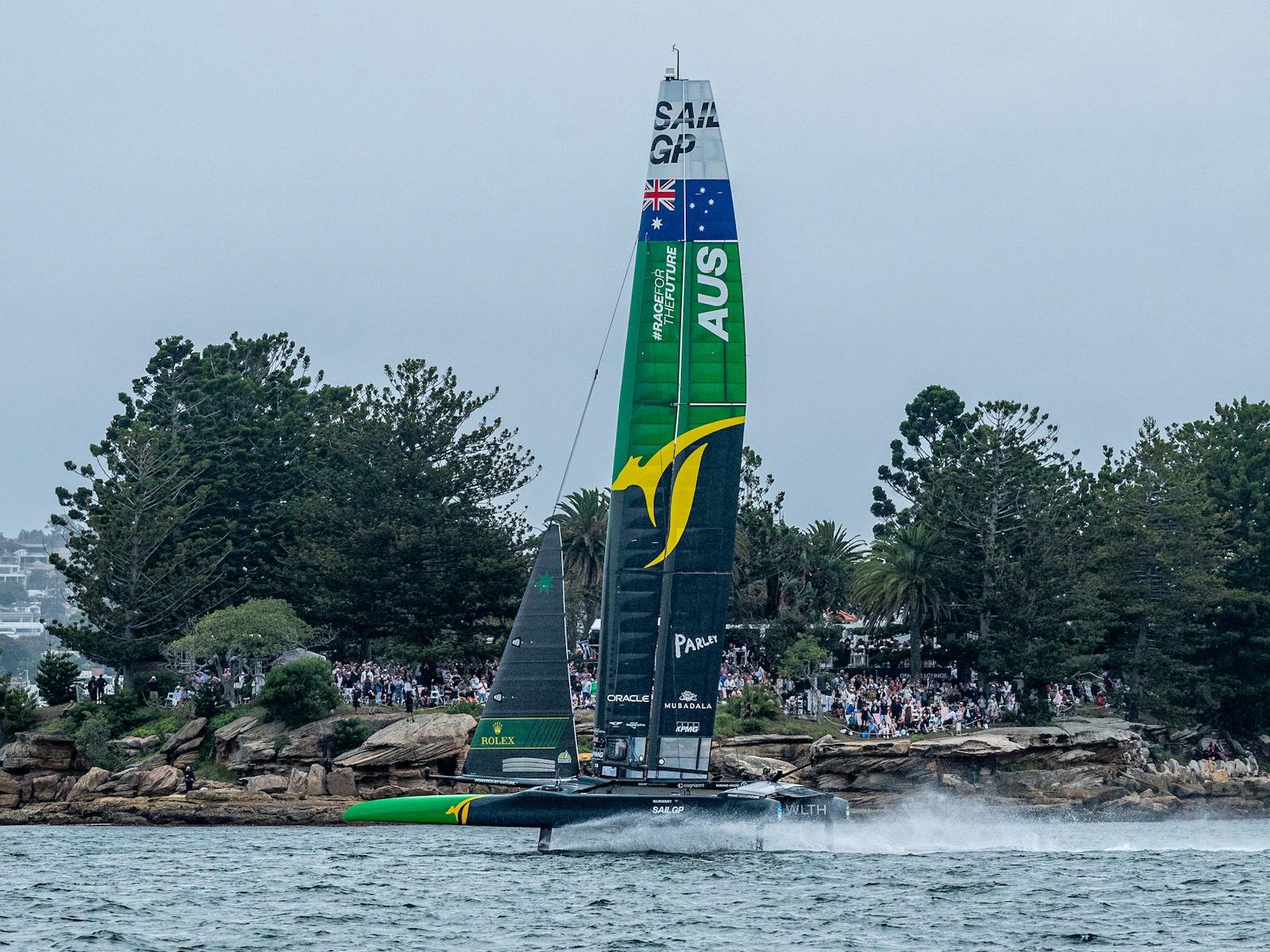 Australia SailGP Team, helmed by Tom Slingsby, sails pas Shark Island on Race Day 1