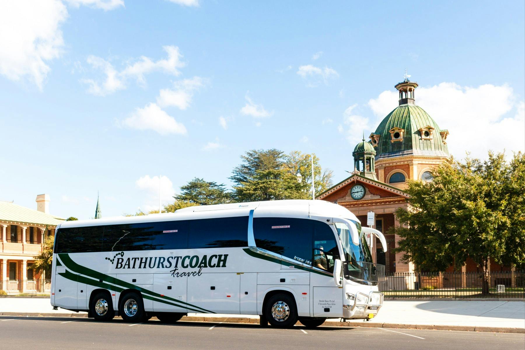 coach bus in front of heritage courthouse