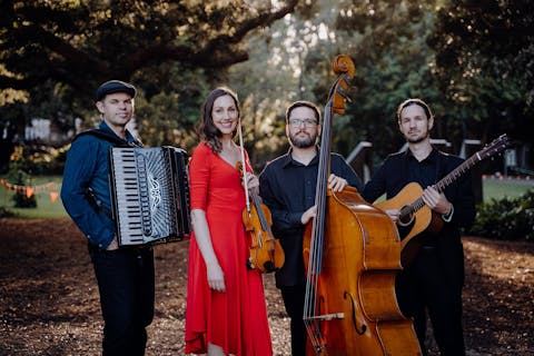 Members of Estampa holding instruments