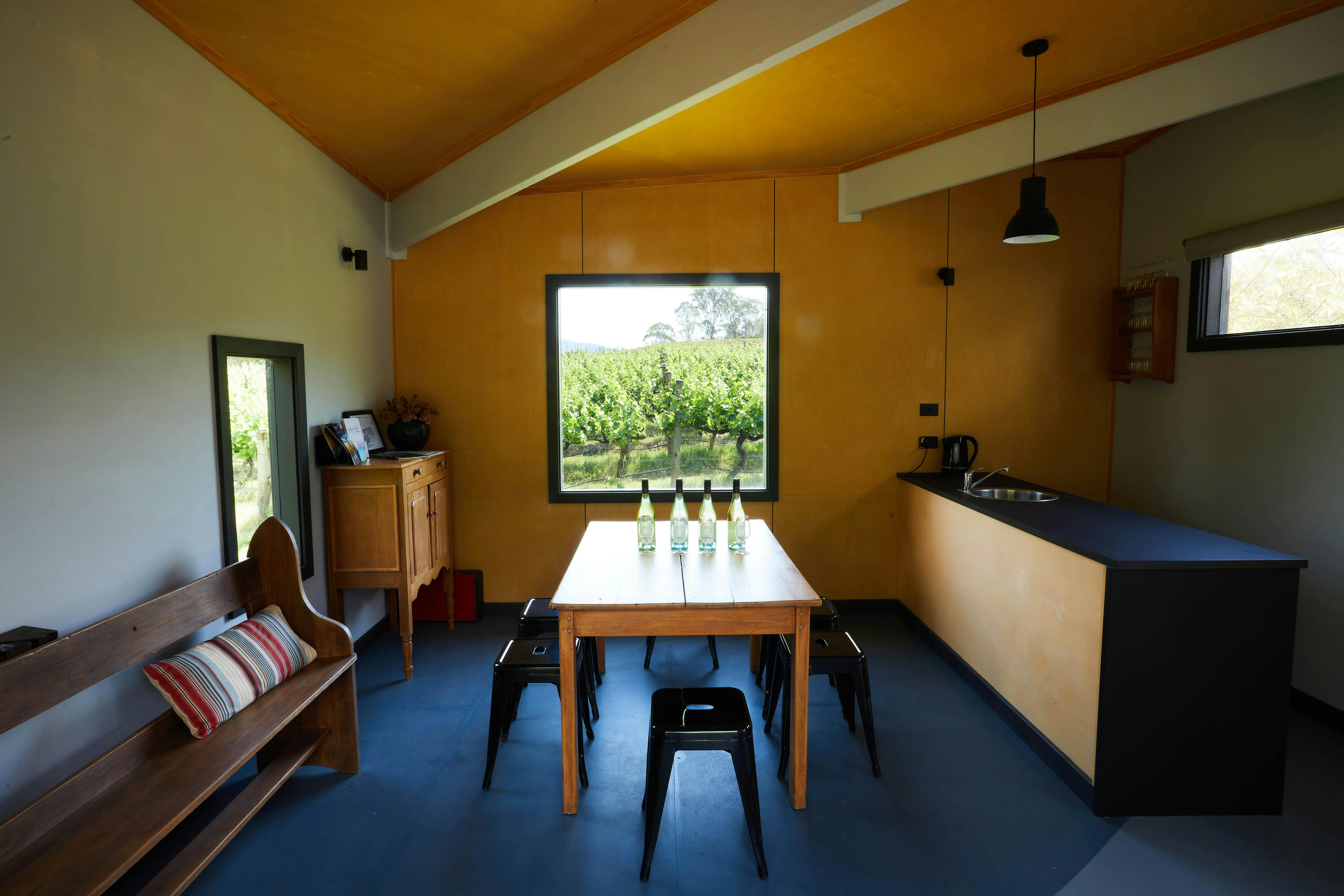 A sunlit spacious Cellar Door with large windows over looking the vines