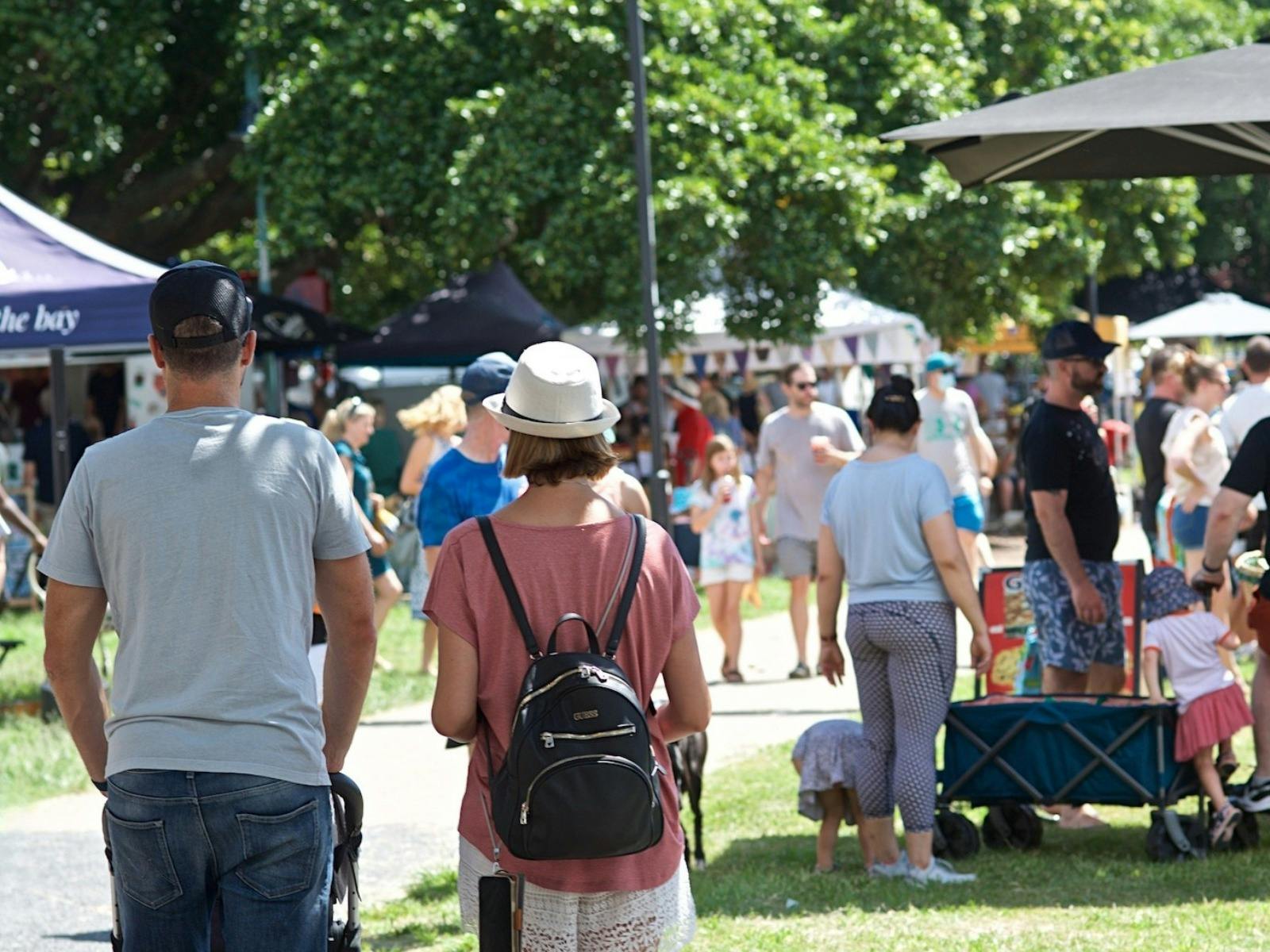 Jan Powers Farmers Markets - Couple strolling through the Manly Markets Jan Powers Farmers Markets - Couple strolling through the Manly Markets