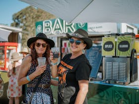 Two woman enjoying a slushie at the vendor bar at Caltowie