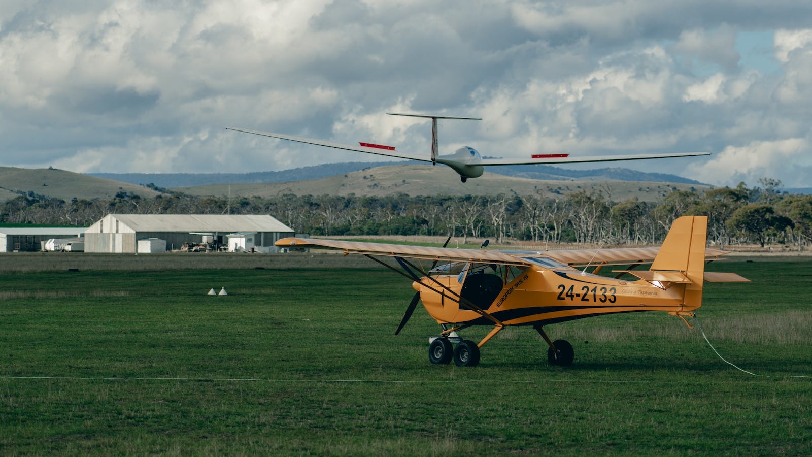 Gliding Tasmania Club Hanger Tug Plane and Glider