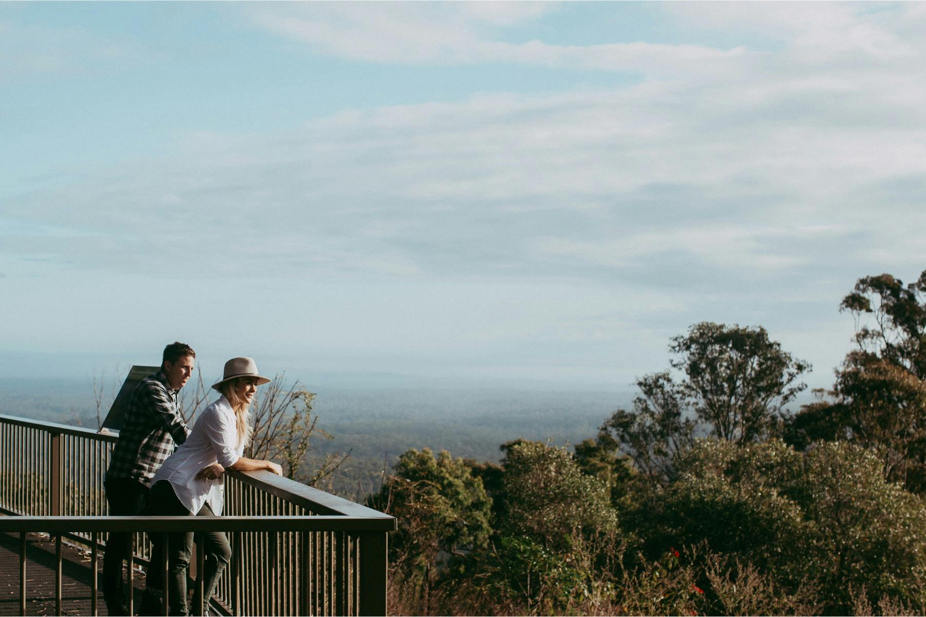 Couple taking in scenic views across Redlands Coast from Eastern Escarpment lookout