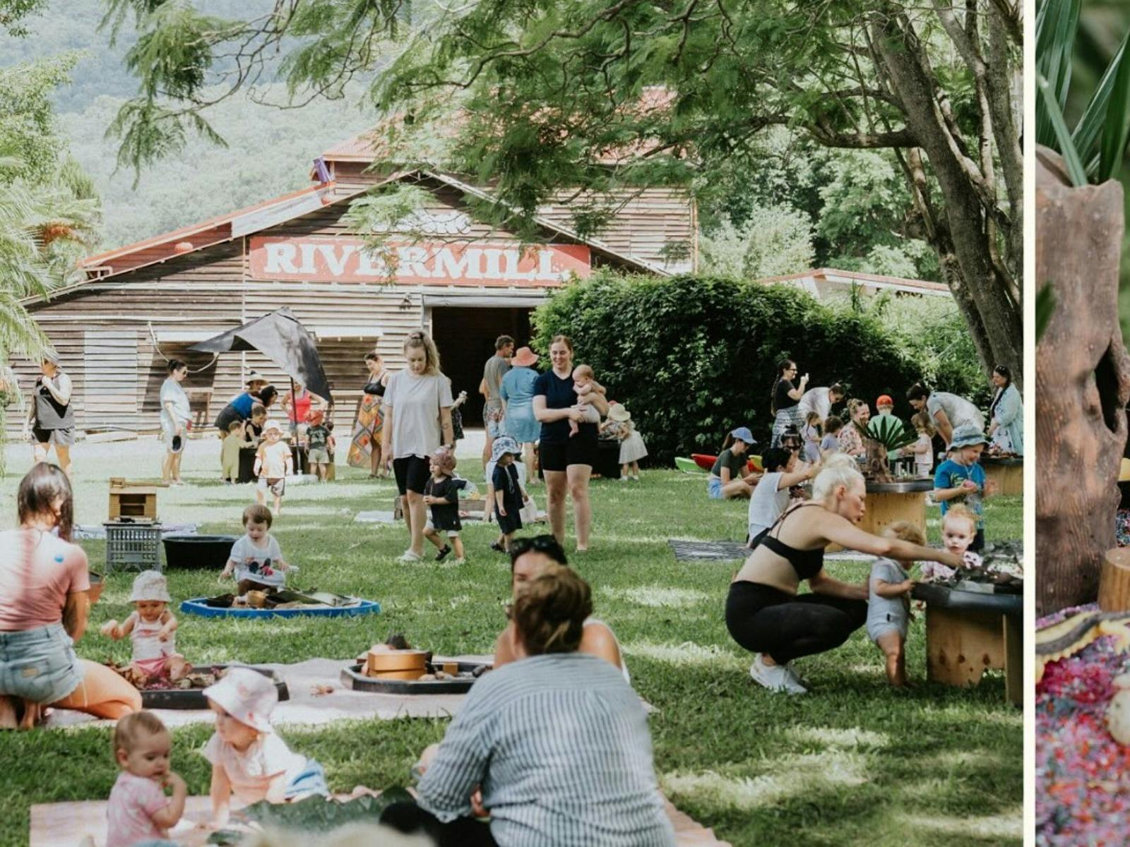 Families and toddlers spread across the lawn of a Messy Play Morning at Historic rivermill.