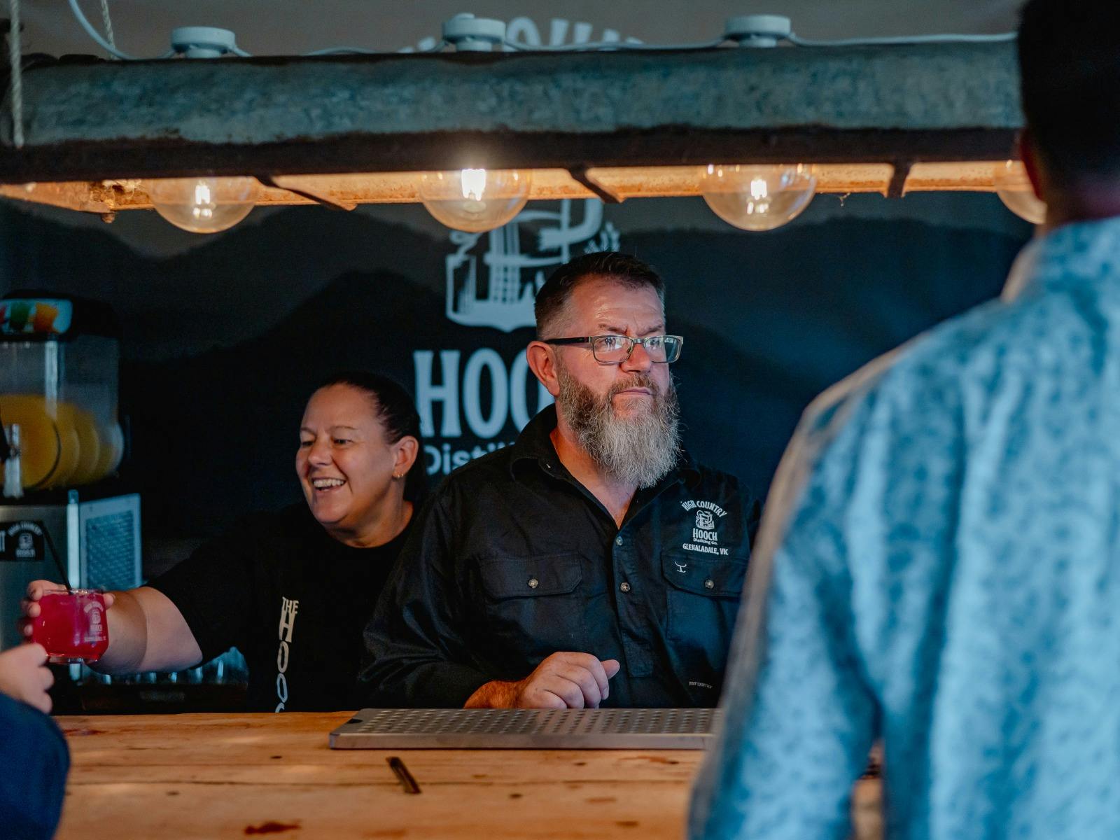 Paul and Leanne serving at the bar