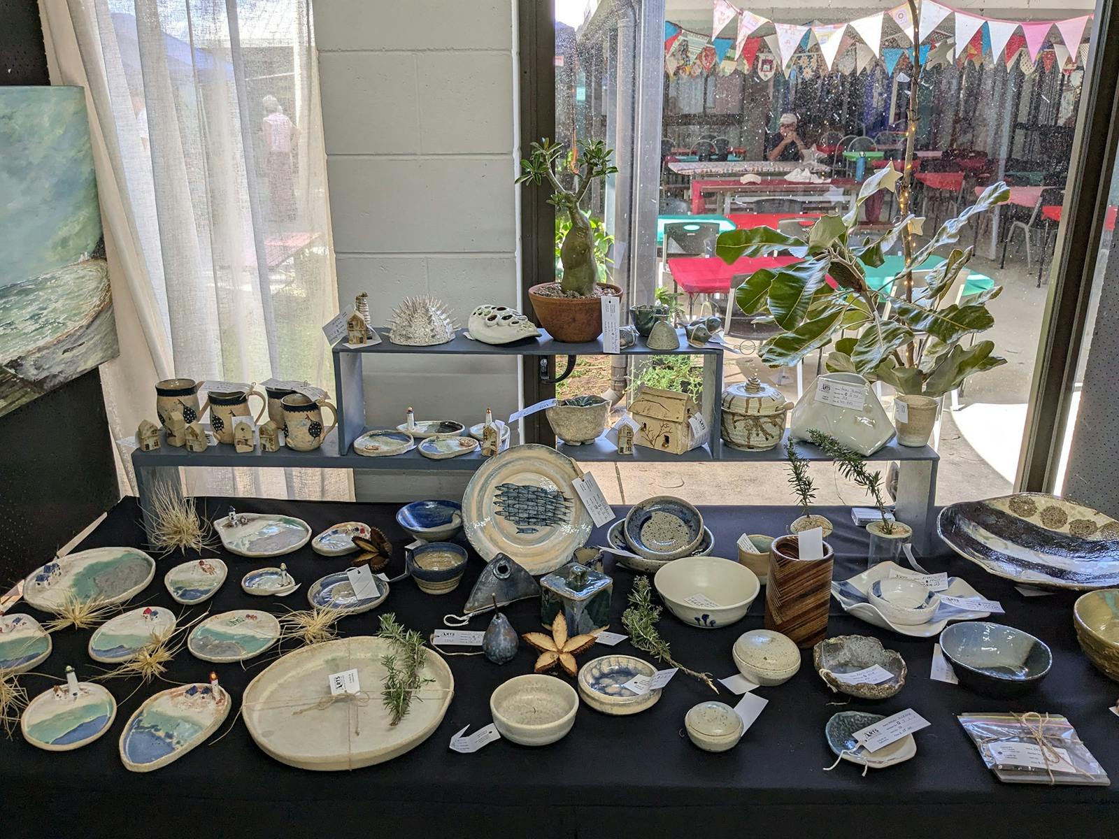 Handmade pottery, and the festive outdoor undercover area at the Caloundra Arts Centre Association