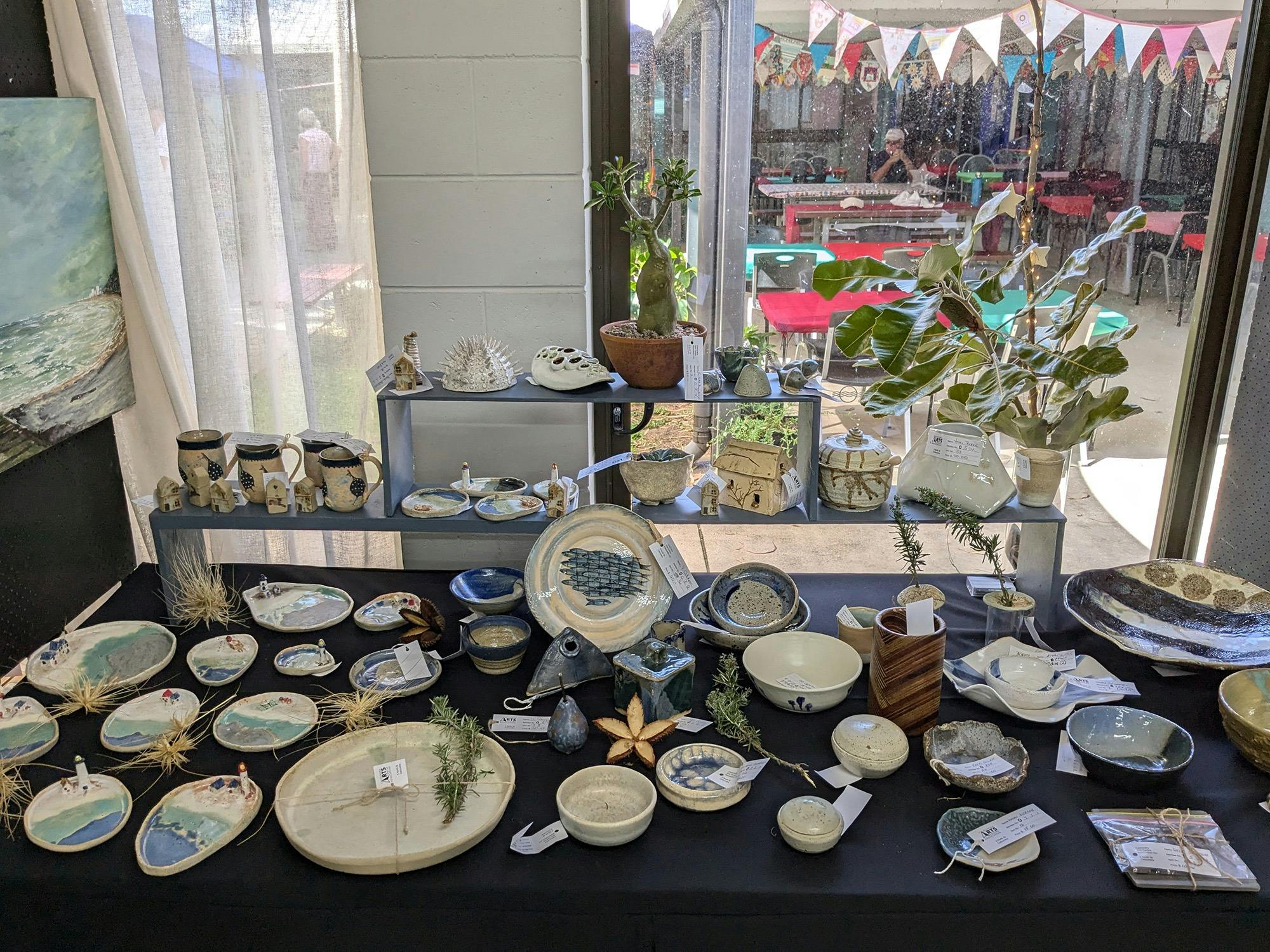 Handmade pottery, and the festive outdoor undercover area  at the Caloundra Arts Centre Association