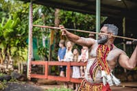 Pamagirri Aboriginal guide showcasing the traditional spear throwing in front of a group of visitors
