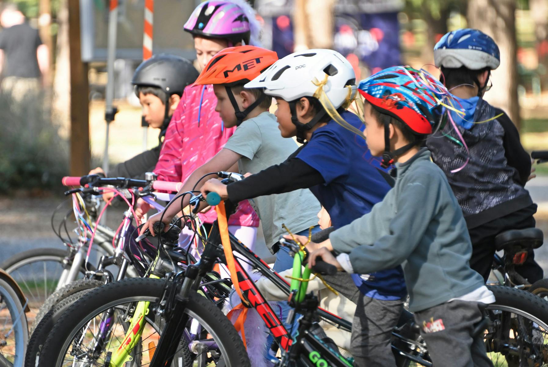 A group of bys with bicycles