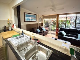 Large communal kitchen and family room ideal for group stays, touring guests and shared dining.