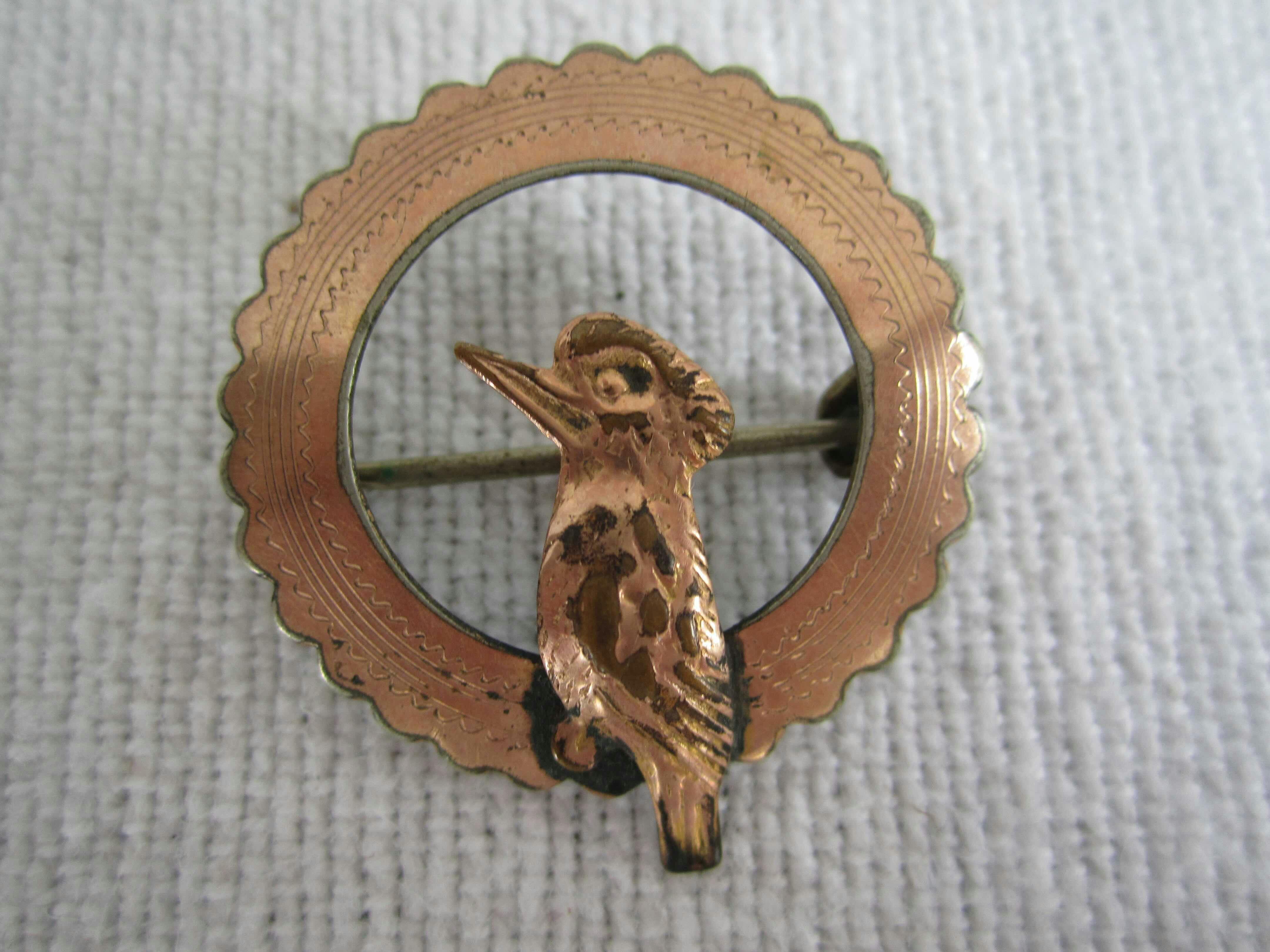 Tin brooch with Kookaburra design