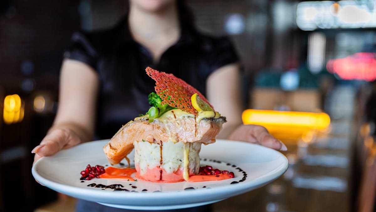 Grilled salmon with chefs potato and seasonal vegetables.