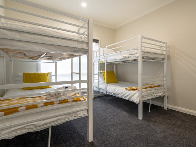 Yellow Bed Room featuring 2 x single bunk beds (4 beds total)