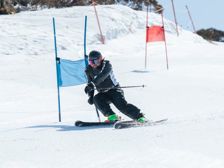 skier riding through racing poles