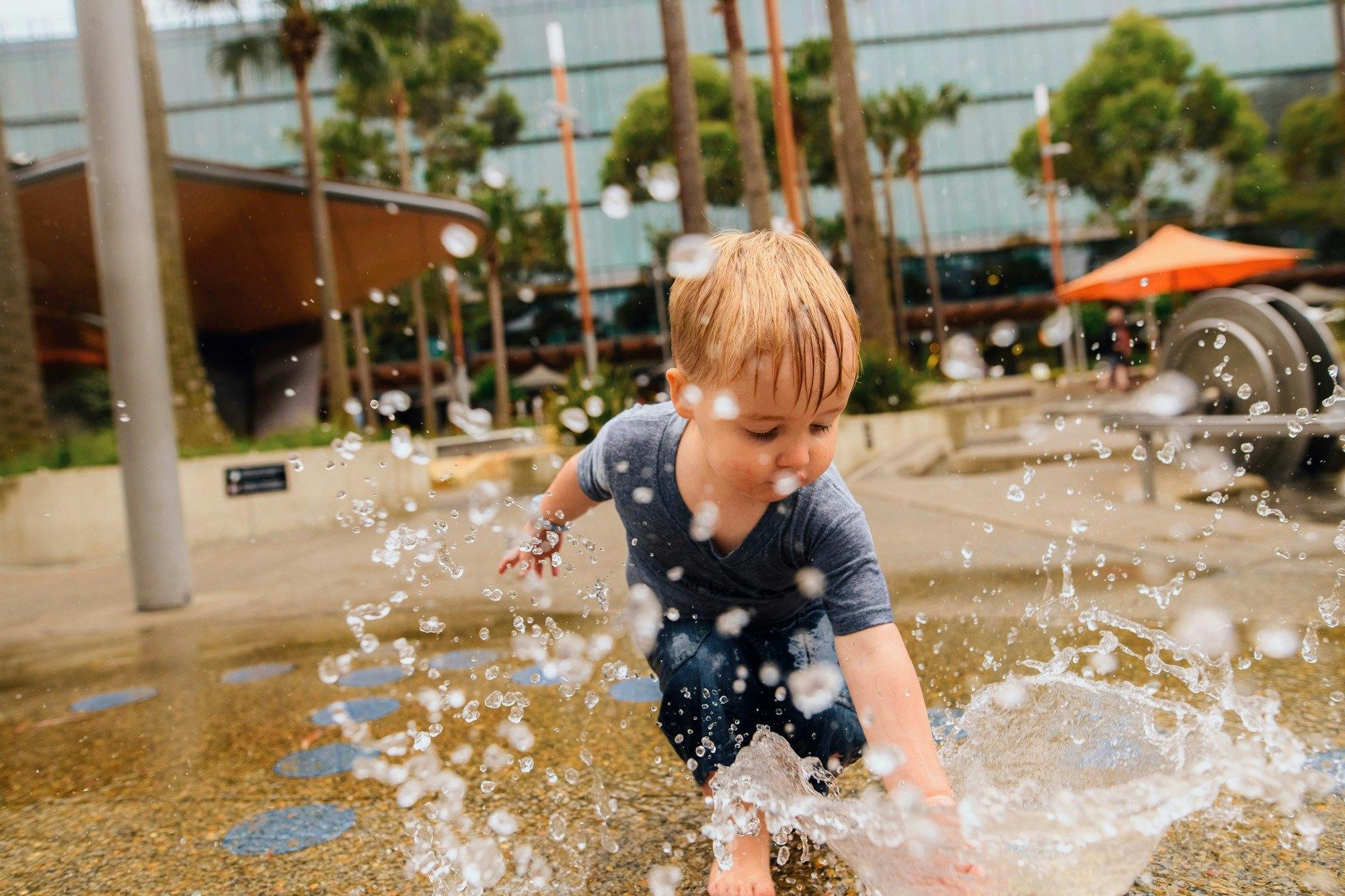 Young boy having a fun day out at The Playground, Darling Quarter
