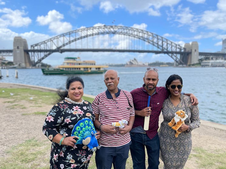 Family with Indian props in front of the Sydney harbour bridge