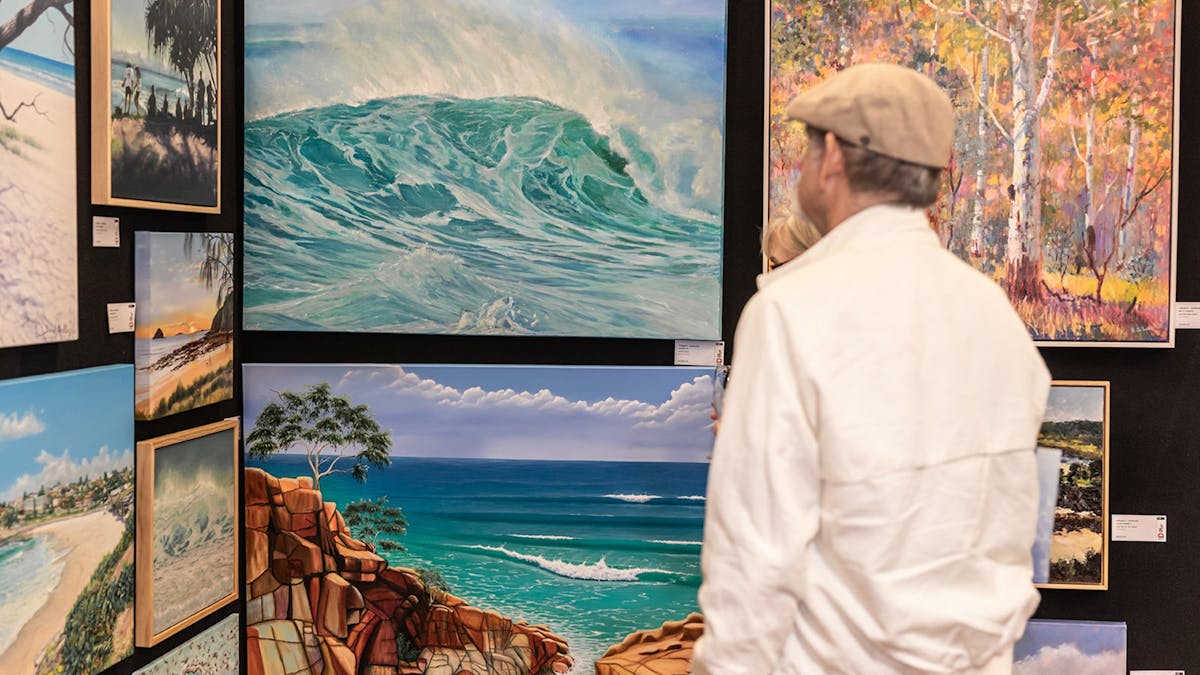 Visitors looking at art at The Doyles