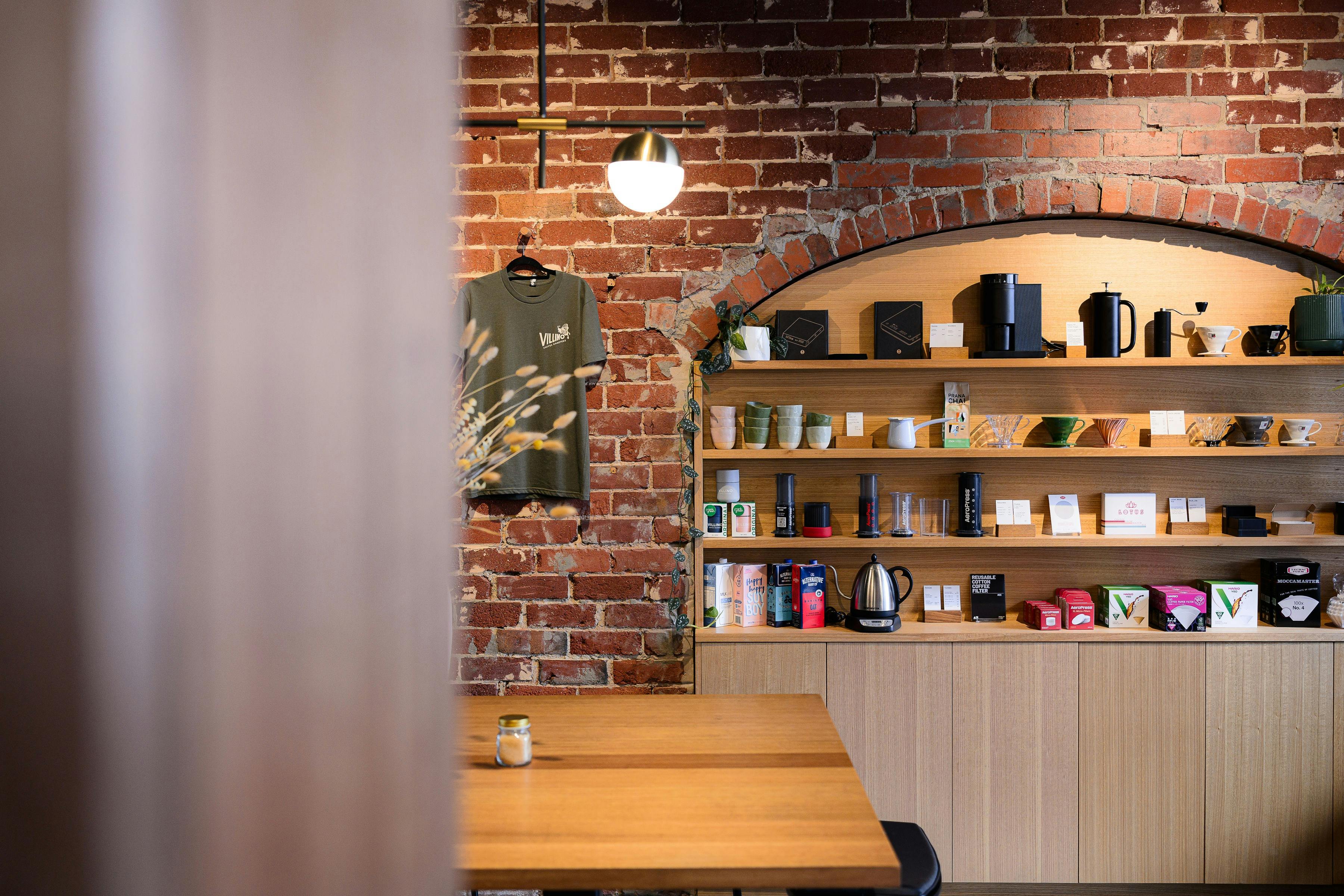 Brick wall with feature arched shelf filled with brew gear