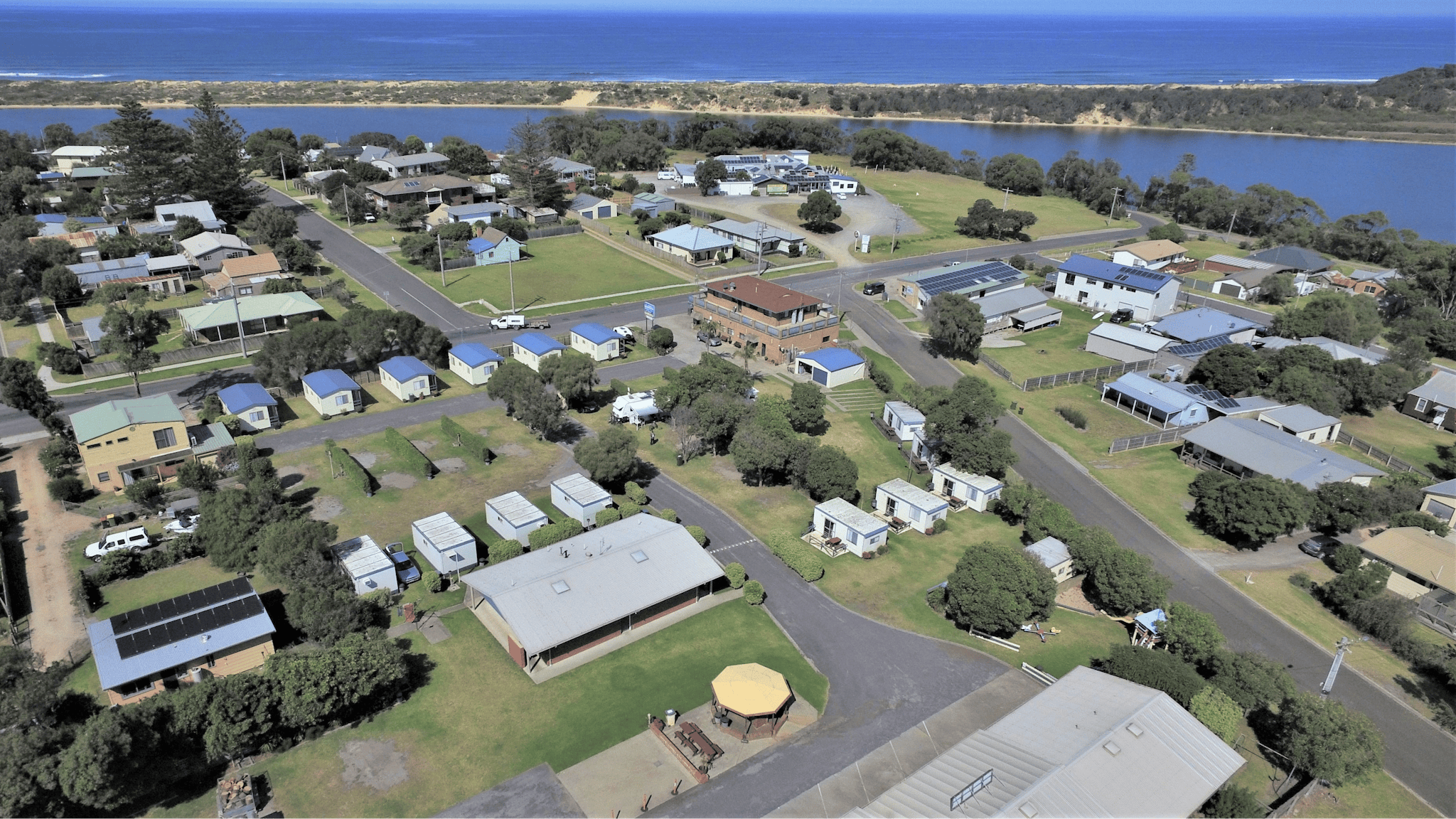 Drone shot overlooking Marlo Caravan Park and Motel's proximity to the beach