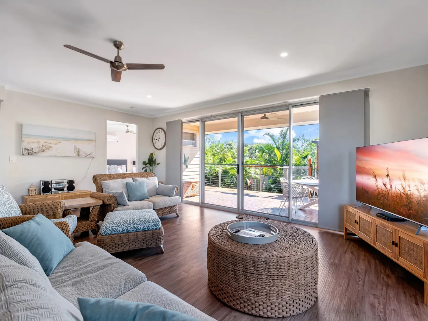 Open plan living area with balcony access