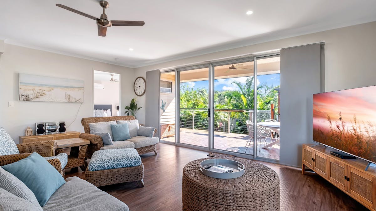 Open plan living area with balcony access