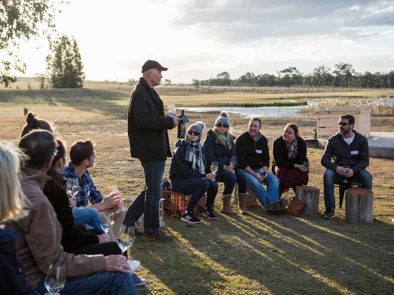 Michael hosting guests around the fire