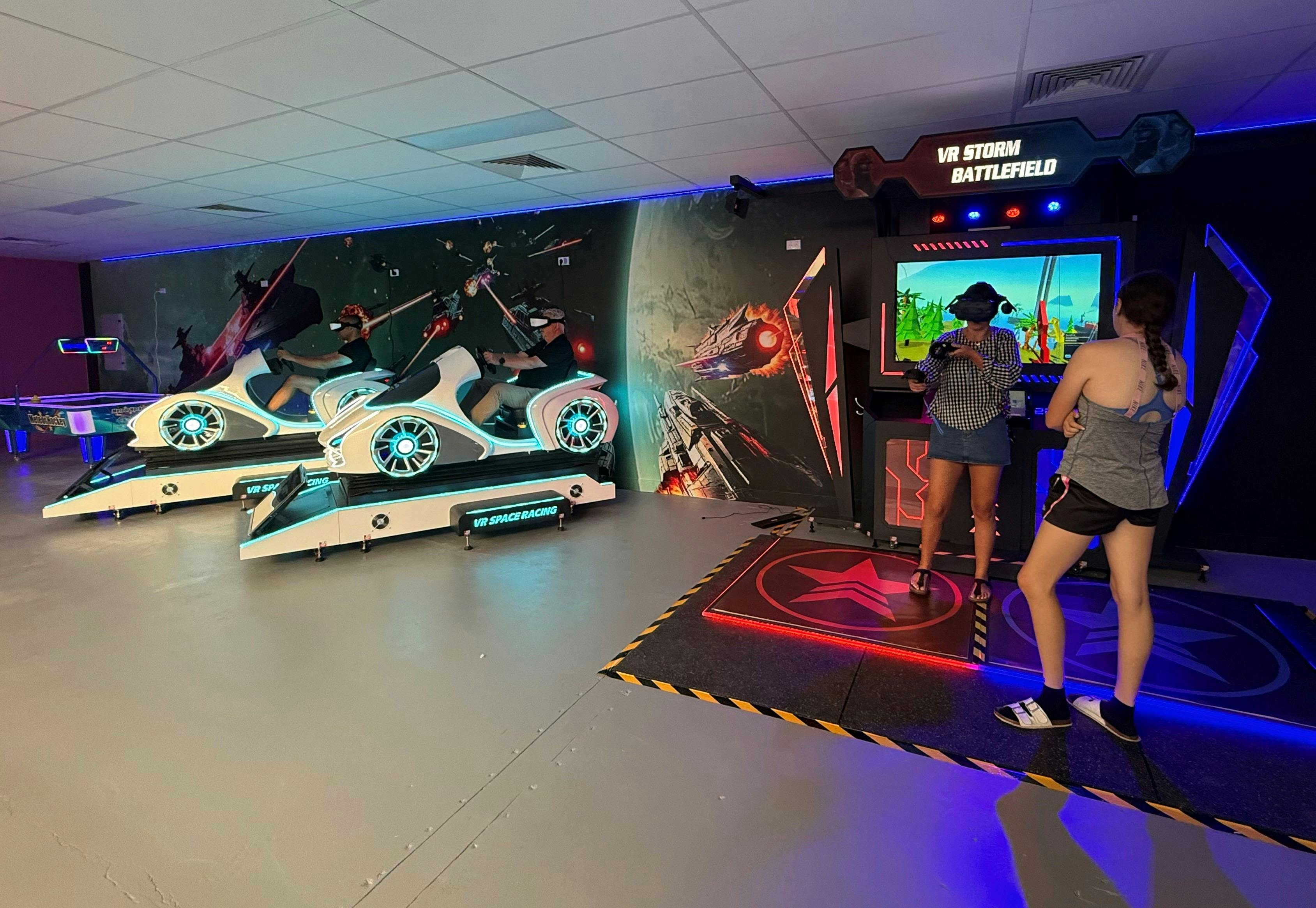 Showcases some of the VR machines including the 'Storm Battlefield' and the 'Space Racers'.