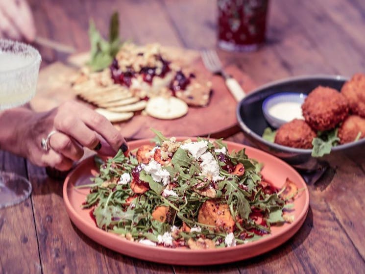 pomegranate salad, arancini balls, baked brie