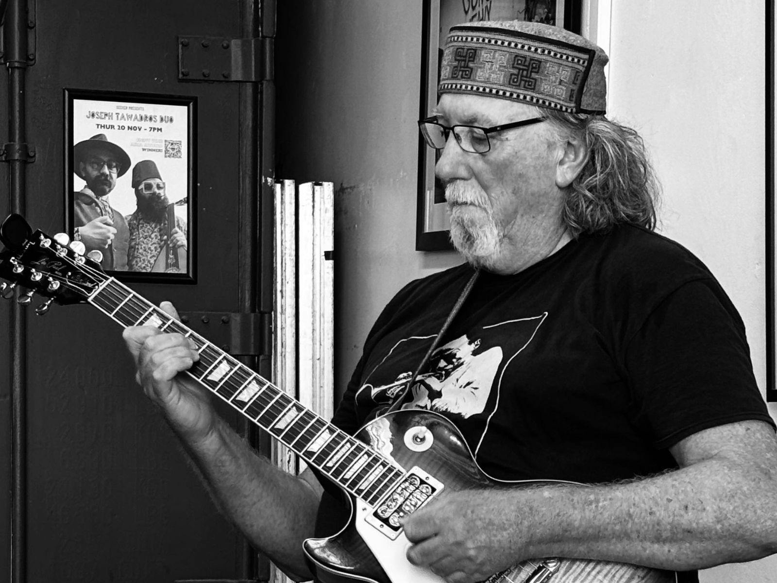 Jeremy Sawkins playing the guitar whilst performing