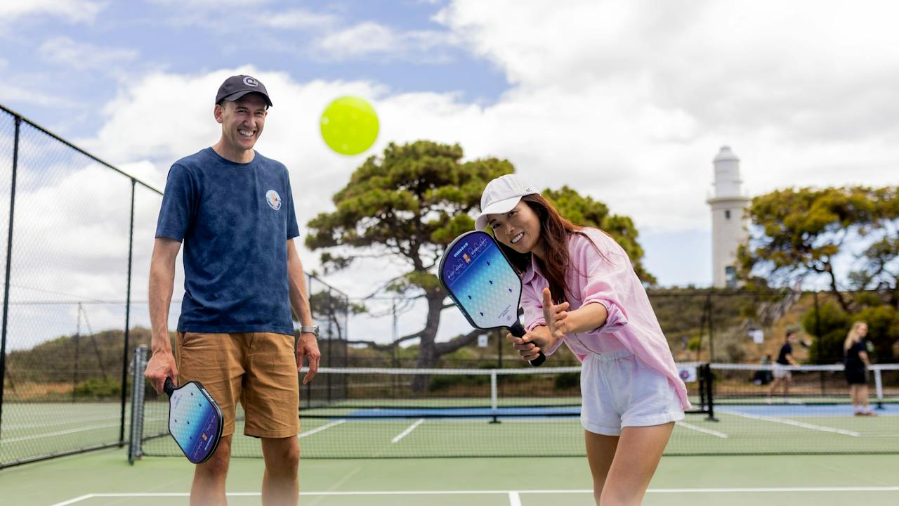 Visitors enjoying pickleball at Rotto Rackets Sports on Wadjemup / Rottnest Island.