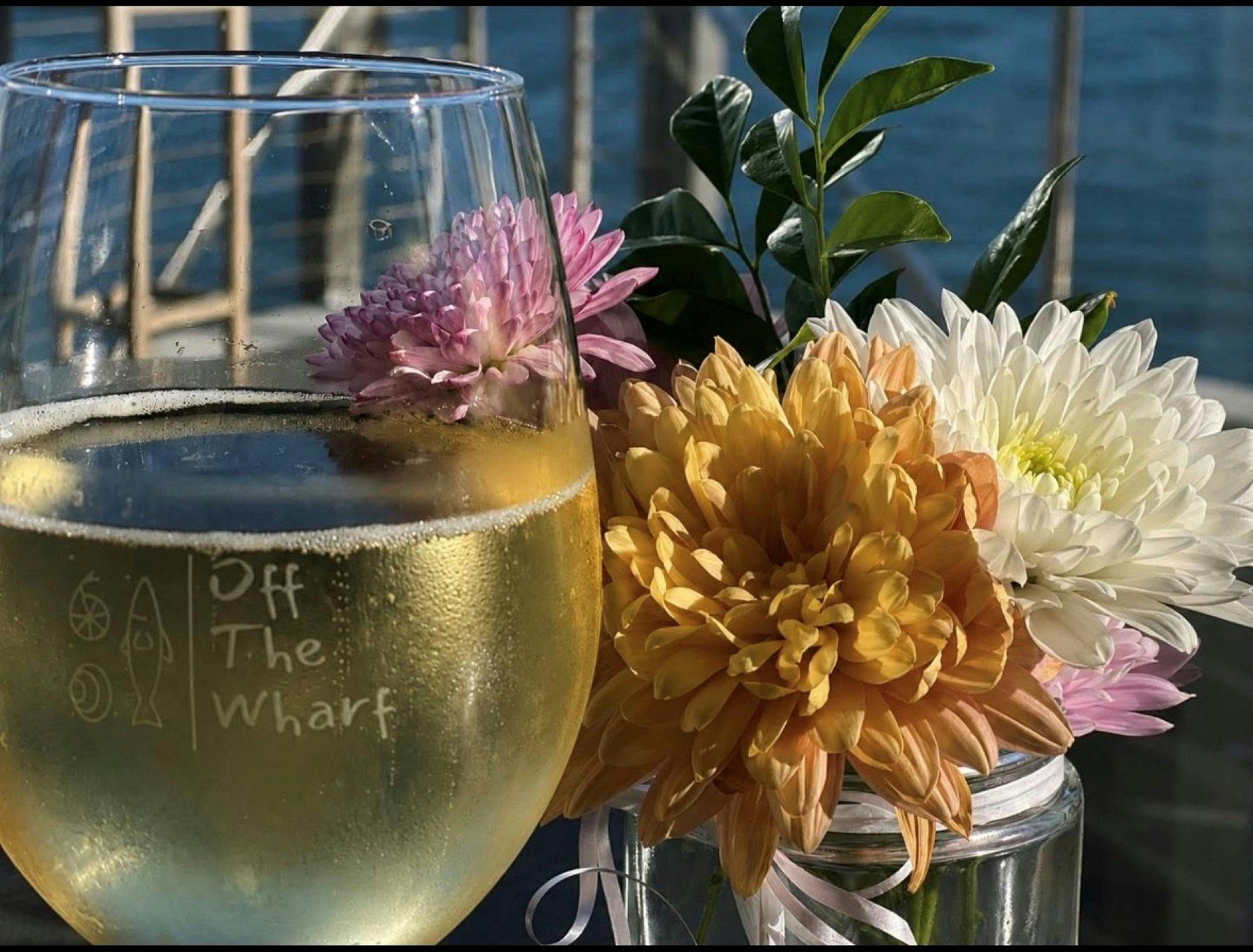 Glass of wine and flowers