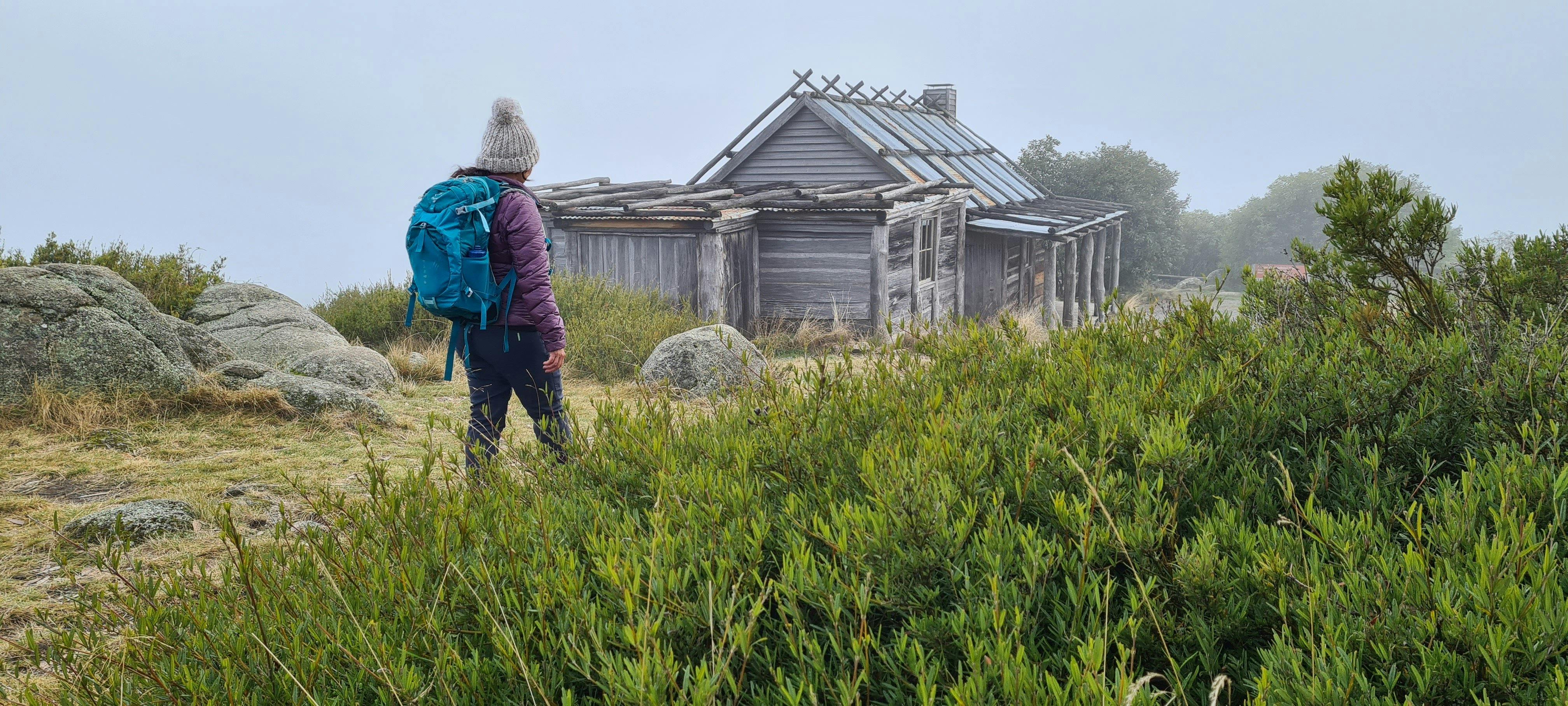 A hiker approaching Craig's Hut.