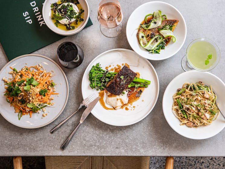 A range of lunch dishes including wagyu brisket, chicken and coconut salad and pasta
