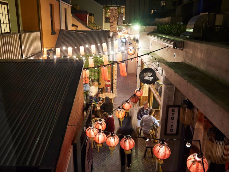 People enjoying Asian hawker-style street food at Spice Alley, Chippendale