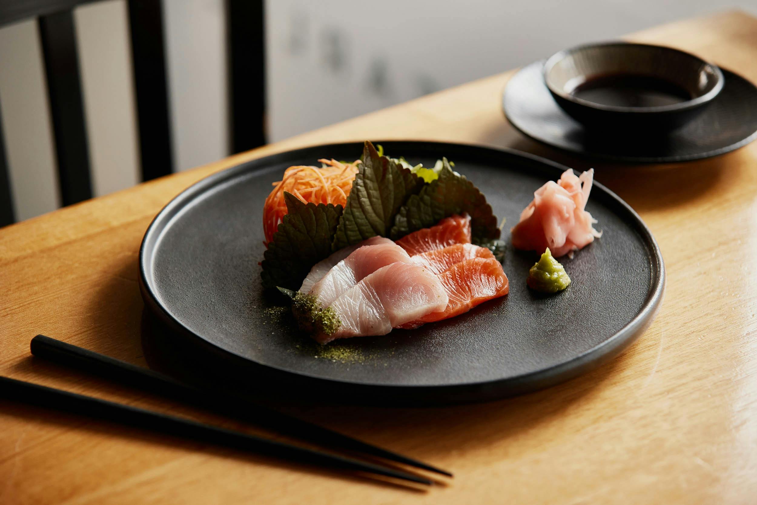 A plate of sashimi grade salmon and kingfish