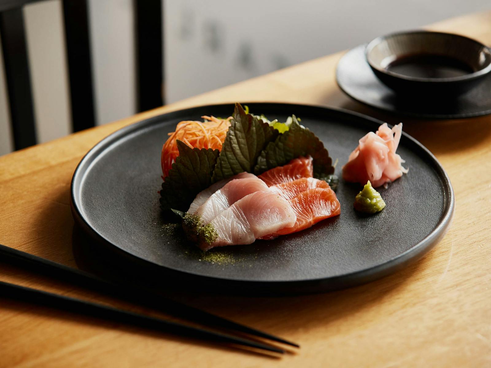A plate of sashimi grade salmon and kingfish