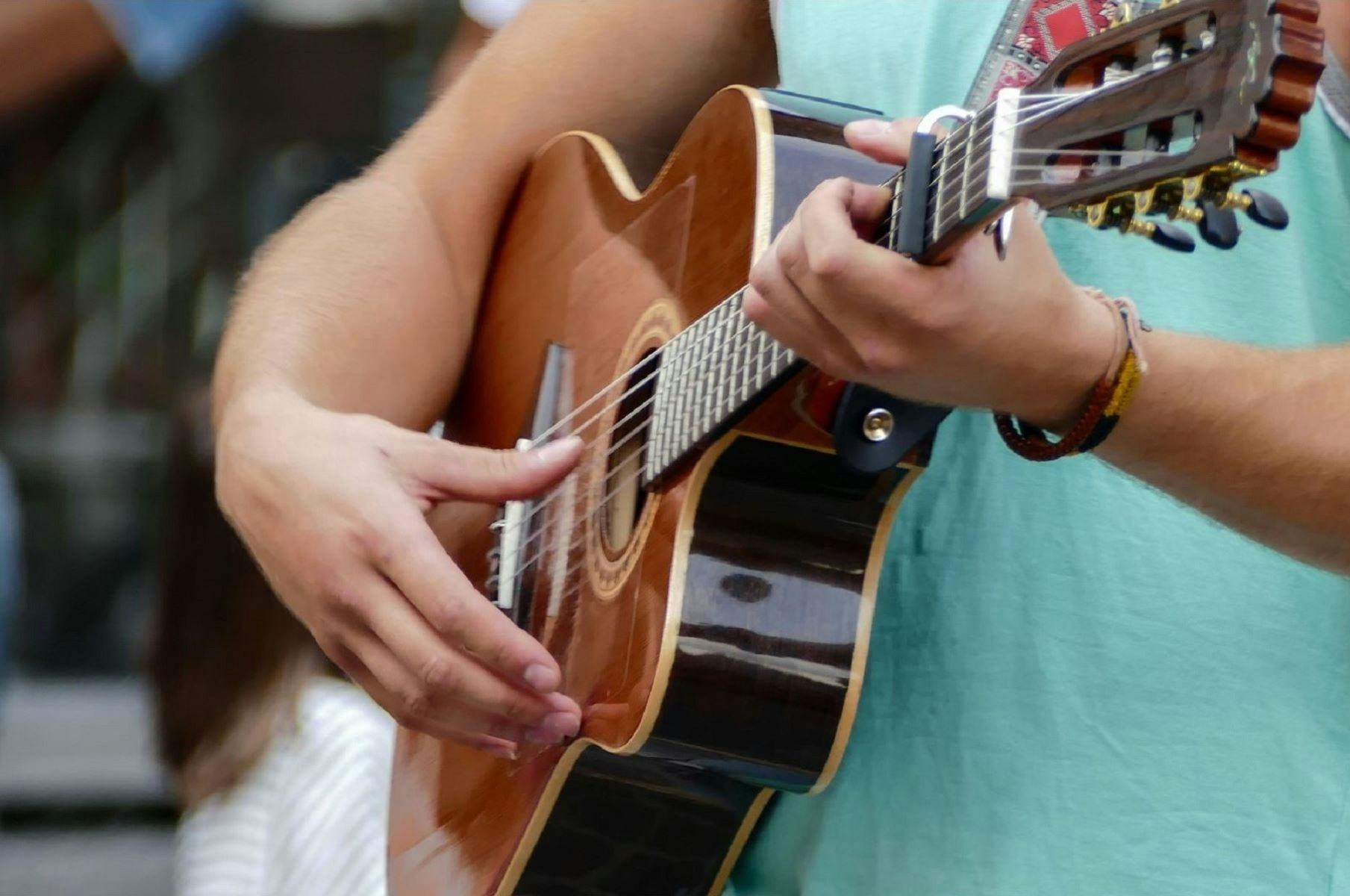 Woman strumming guitar