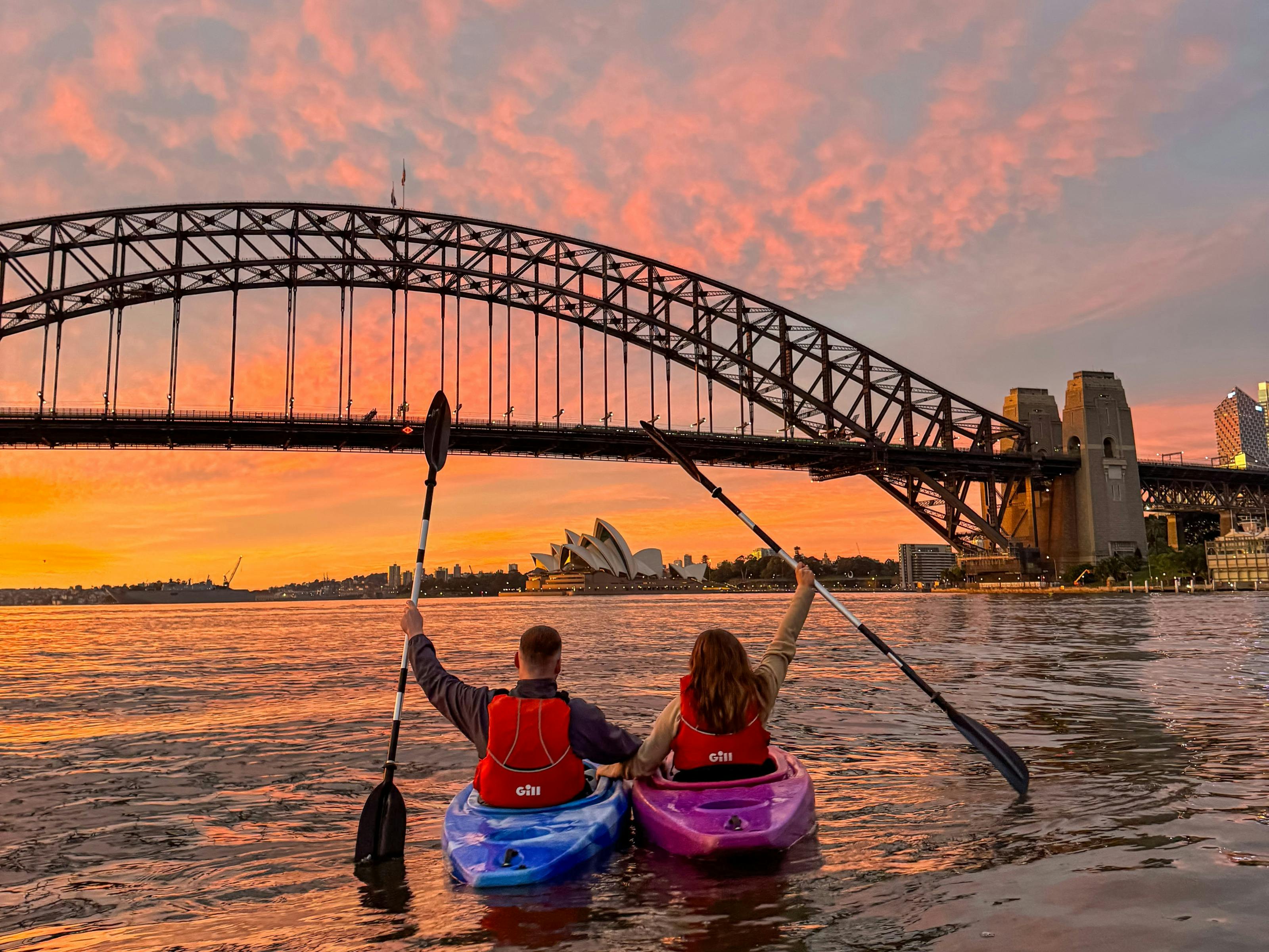 Orange and Pink sunsets above Sydney By Kayak from Lavender Bay on Sydney Harbour.