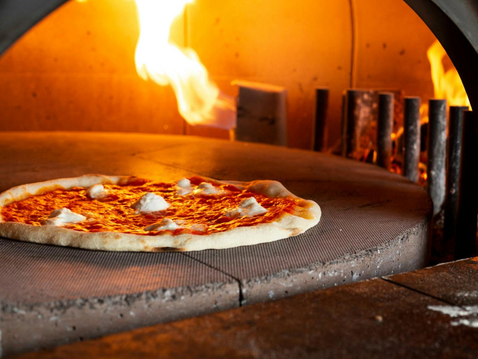 Dal Zotto Wines Woodfired Pizza cooking in the pizza oven