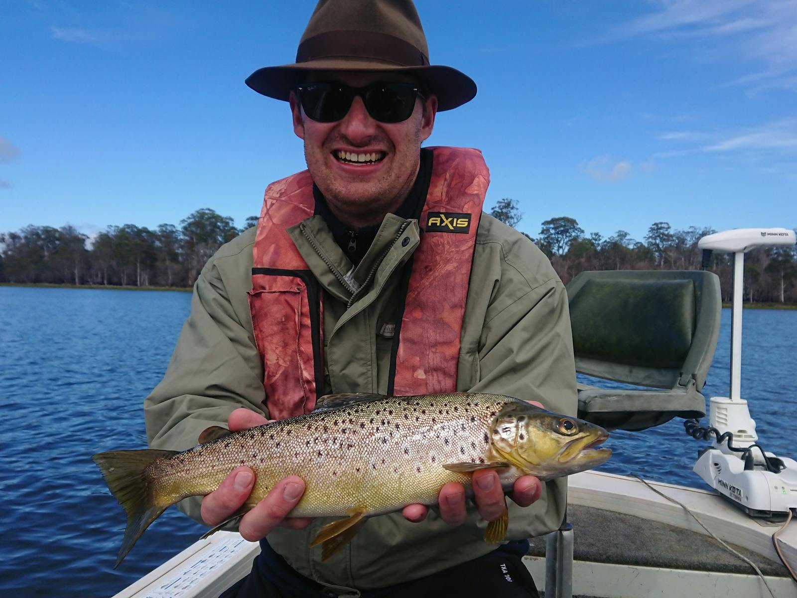 Lex with a wild trout caught on a lake in Tasmania's Central Highlands