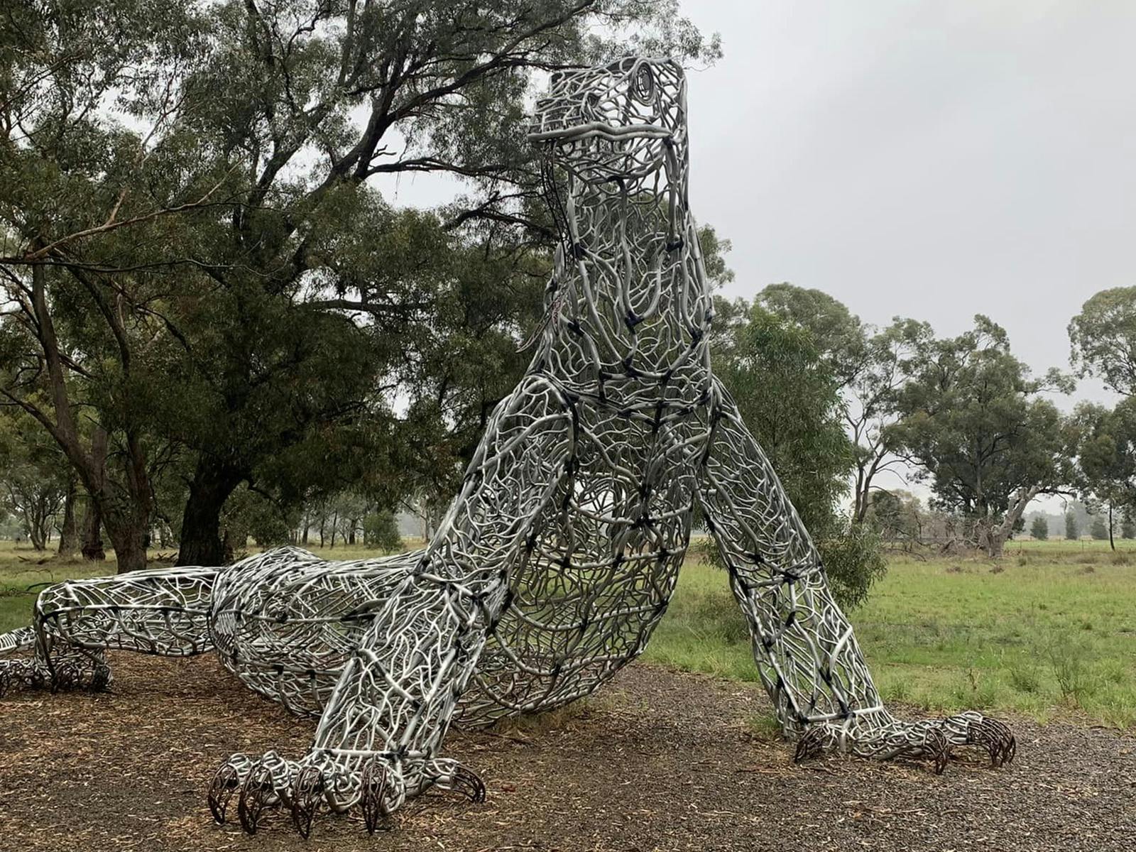 A steel sculpture of a goanna