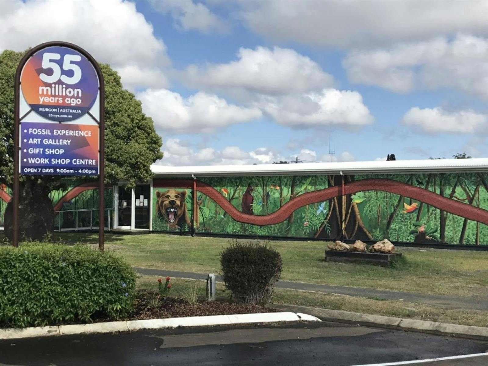 Large murals are located on the front walls of the building. Large murals are located on the front walls of the building.