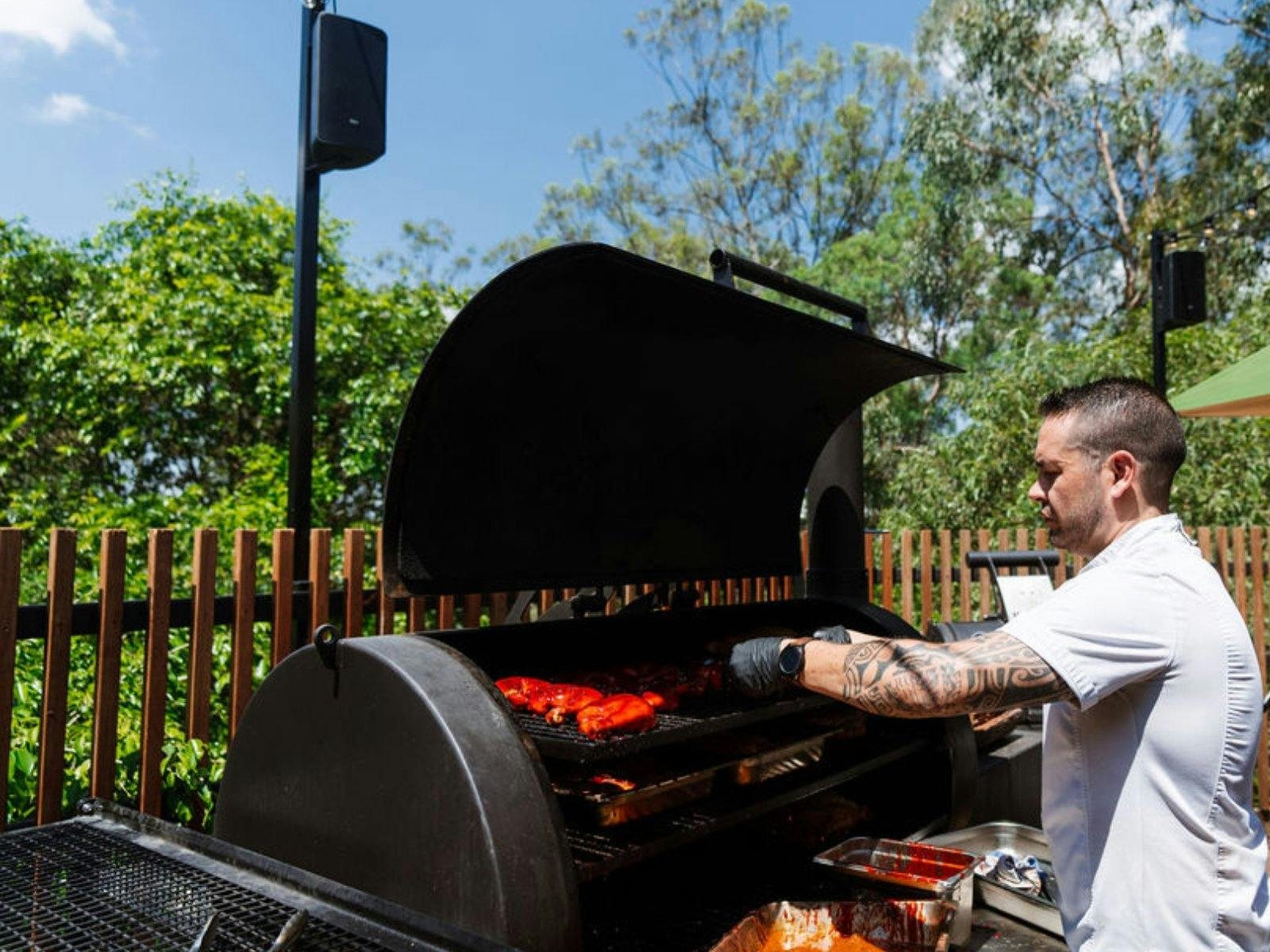 Man grilling on a BBQ Man grilling on a BBQ