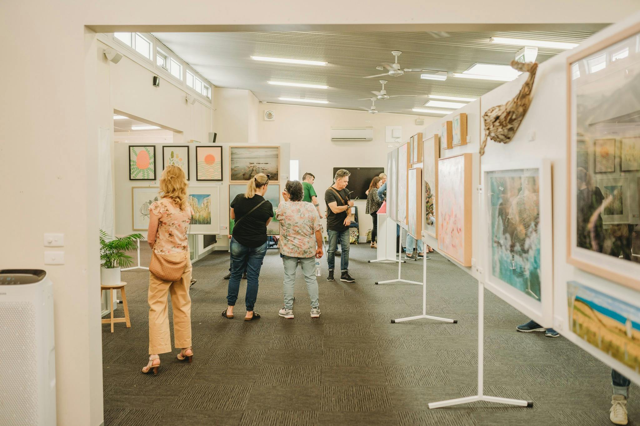 People viewing art at the art exhibition