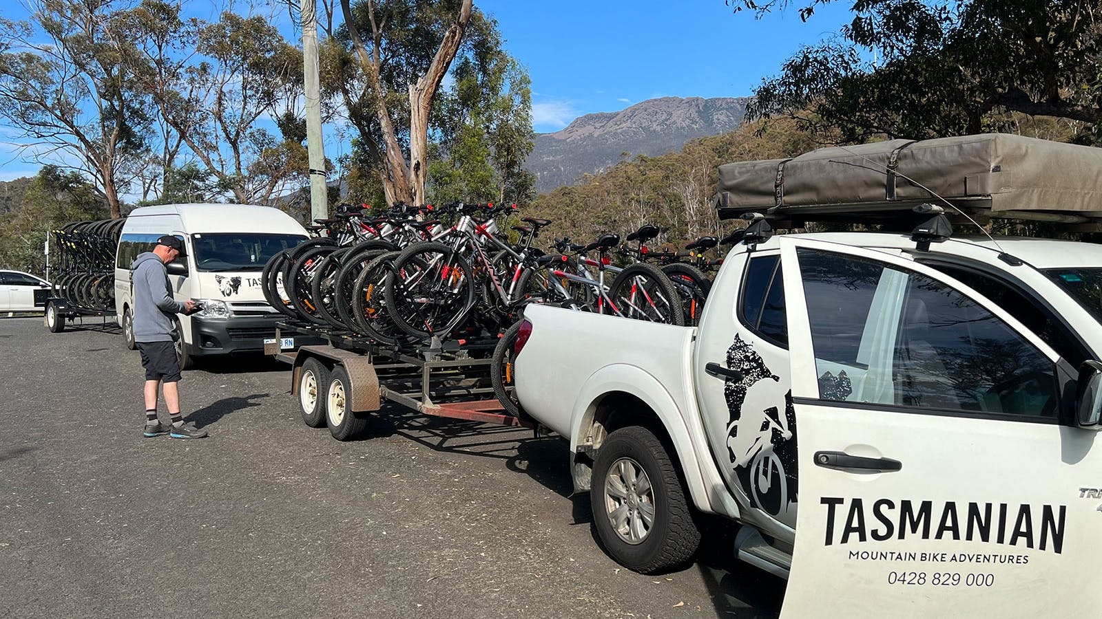 Ute and bus shuttling bikes
