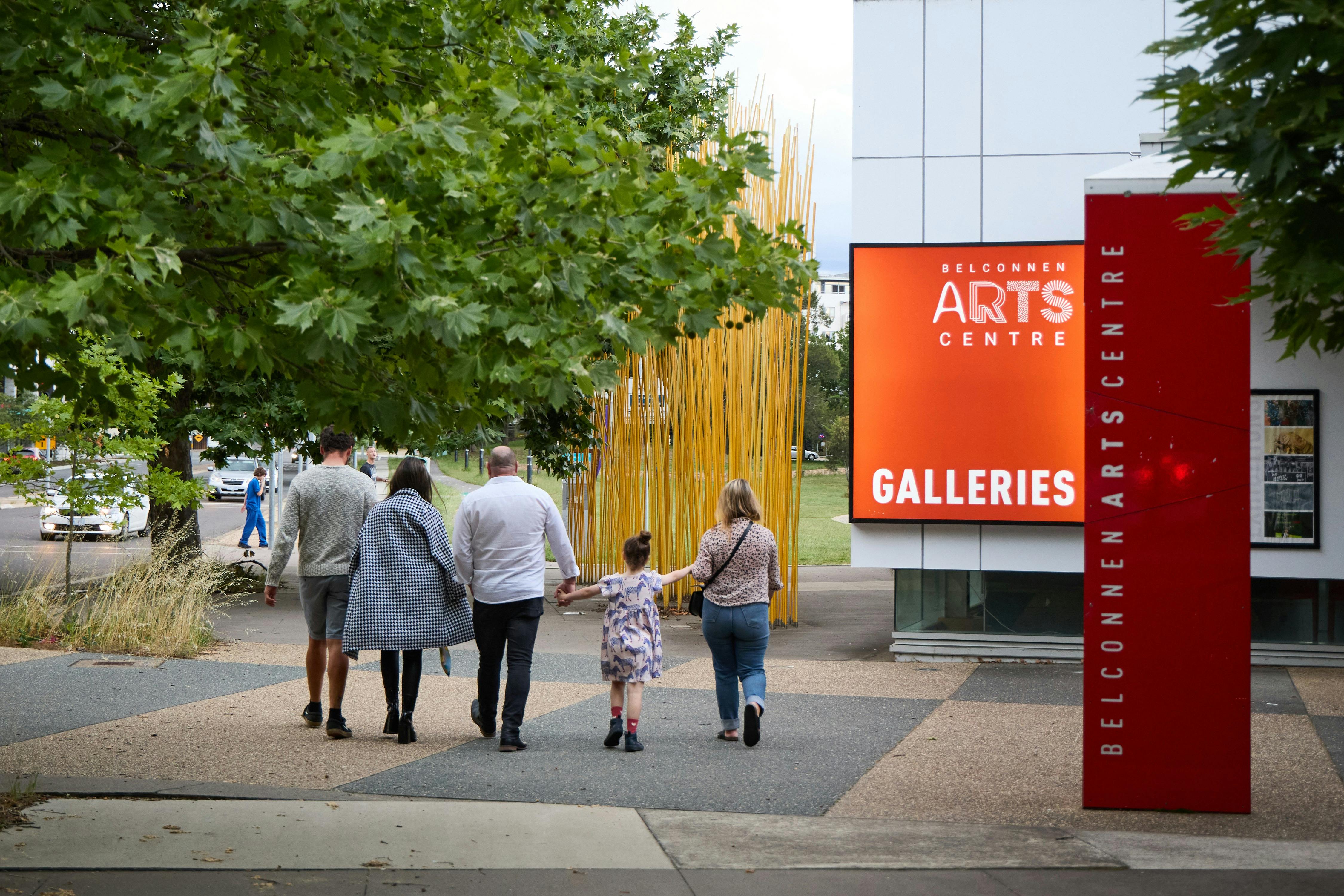 A family walk together by Belconnen Arts Centre.